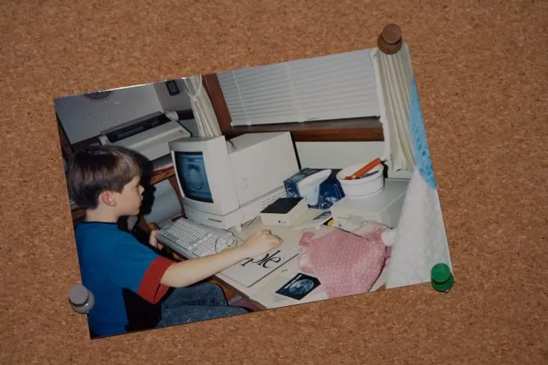Jason at a young age working on a Macintosh LC